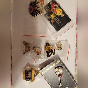 Several hard rock Cafe pins